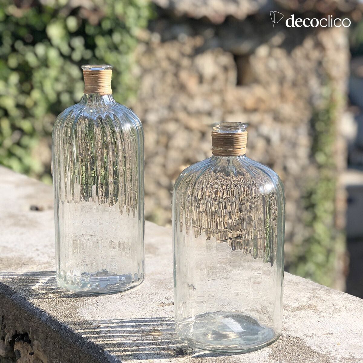 Glass cylinder with ridged surface and rush-covered neck 26 x 13 cm Suzanne