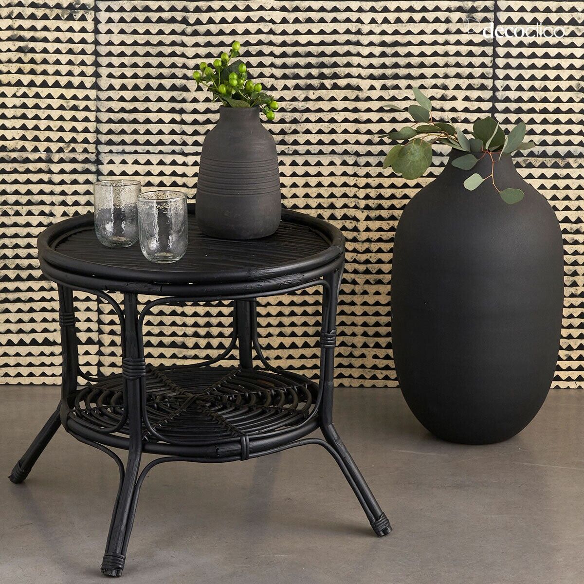 Low pedestal table in black rattan