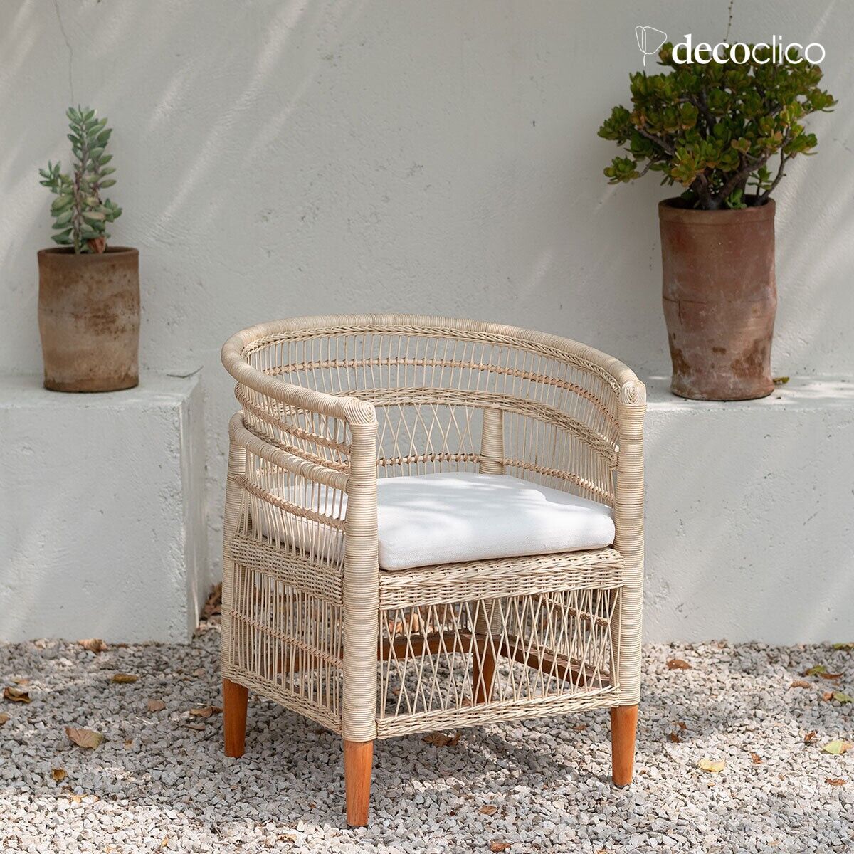 Malawi-inspired rattan armchair with chevron canvas seat cushion