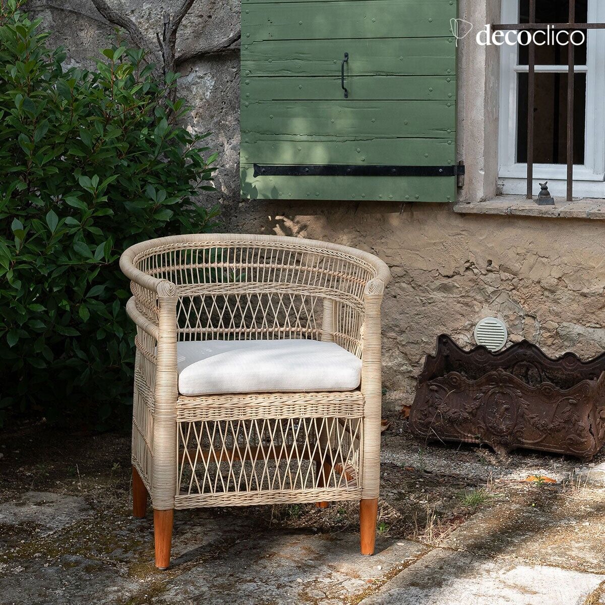 Malawi-inspired rattan armchair with chevron canvas seat cushion