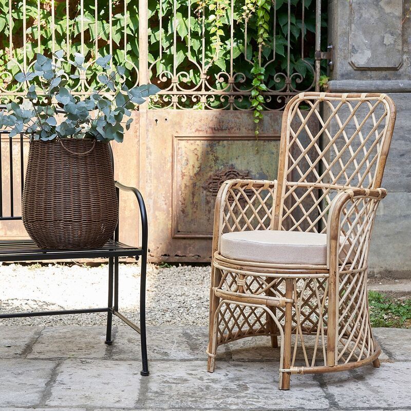 Natural rattan armchair with cotton cushion